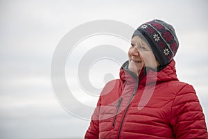 Happy mature woman outdoors on a cold day