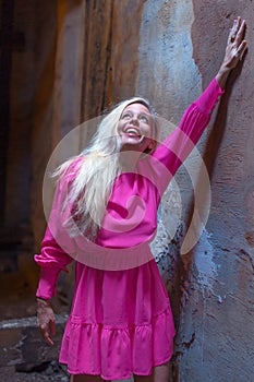 Happy mature woman in pink dress enjoying new beginning
