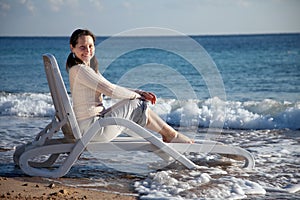 Happy mature woman on sea beach