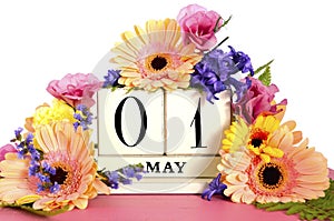Happy May Day calendar with flowers. photo