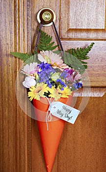 Happy May Day gift of flowers on door.