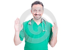 Happy medic or doctor doing a falsehood statement