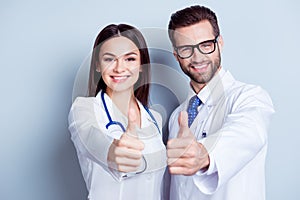 Happy medic workers. Portrait of two doctors in white coats and