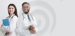 Happy Medic Workers. Portrait Of Two Doctors In White Coats