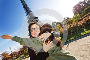 Happy meeting of two women hugging in the street