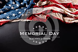 Happy Memorial Day. American flags with the text REMEMBER & HONOR against a black  background. May 25