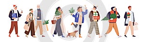 Happy merry people walking and carrying gift boxes, presents, Christmas trees, parcels after shopping in December, at