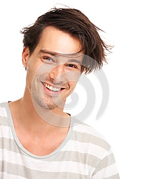 Happy, messy hair and portrait of man in studio for casual, trendy and cool fashion. Happiness, edgy and confidant with