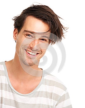 Happy, messy hair and portrait of man in studio for casual, trendy and cool fashion. Happiness, edgy and confidant with photo