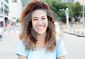 Happy mexican girl outdoor in the city