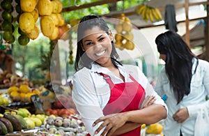 Happy mexican saleswoman on a farmers market