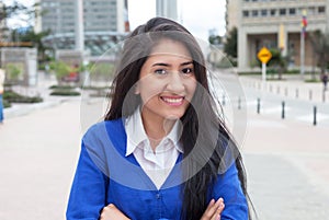 Happy mexican woman in the city