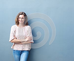 Happy mid adult woman smiling with arms crossed