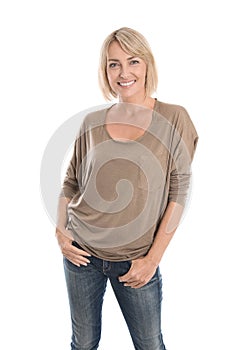 Happy middle age blond woman in blue jeans isolated over white.