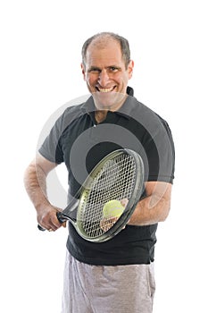 Happy middle age man playing tennis