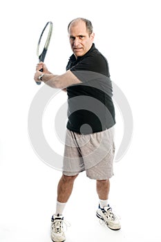 Happy middle age man playing tennis