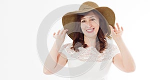 Happy middle age woman in summer hat isolated on white background with copy space. Summertime accessory face wrinkle skin