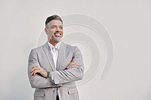 Happy middle aged business man looking away isolated on white wall.