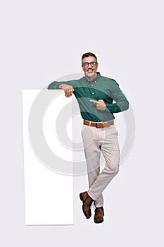 Happy middle aged business man pointing at big phone mockup screen.