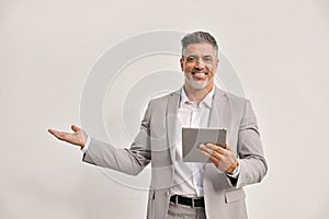 Happy middle aged business man using digital tablet isolated showing aside.