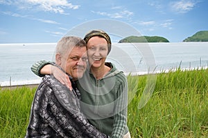 Happy middle aged couple by the sea.