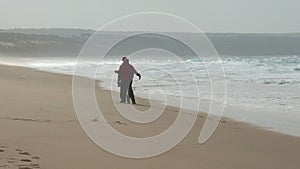 Happy Middle-aged Couple Walking on Beach