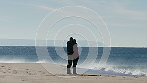 Happy Middle-aged Couple Walking on Beach