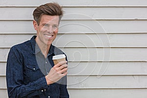Happy Middle Aged Man Drinking Coffee