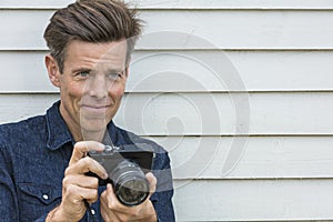 Happy Middle Aged Man Photographer Using Camera