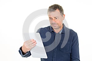 Happy middle aged man using digital tablet computer isolated on white background