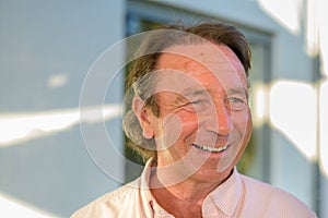 Happy middle-aged man with a wide beaming smile