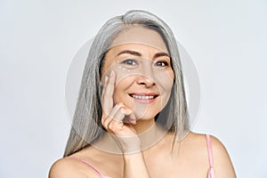 Happy middle aged mature asian woman headshot portrait. Skin care, eye care ads