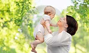 Happy middle-aged mother with little baby daughter