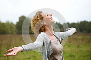 Happy middle aged woman enjoying life photo