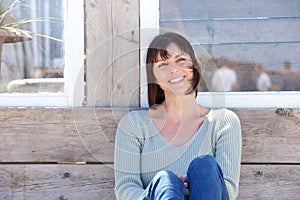 Happy middle aged woman smiling outdoors