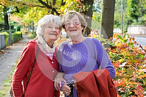 Happy Middle Aged Women in Autumn Outfits.