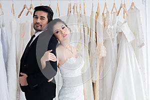 Happy mix race wedding and shopping concept, couple hold hand together love and passion in fitting room with copy space, beautiful