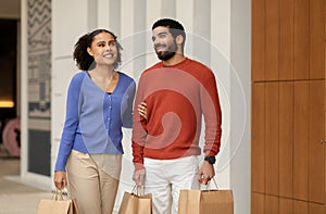 Happy Mixed Family Couple Shopping Together Enjoying Weekend Outside