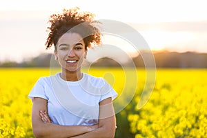 Happy Mixed Race African American Teenager Woman Yellow Flowers