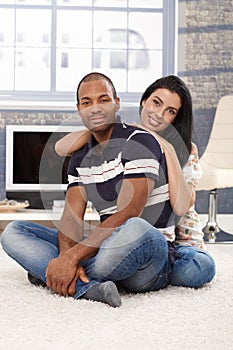 Happy mixed race couple at home photo