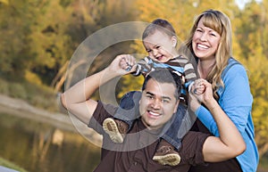 Happy Mixed Race Ethnic Family Outdoors photo