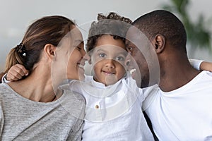 Happy mixed race family bonding head shot close up portrait. photo