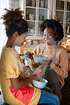 Happy mixed race family, mother daughter spending quality time together, talking