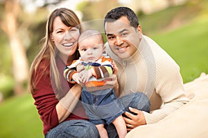 Happy Mixed Race Family Posing for A Portrait