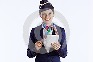 happy modern air hostess woman on white using tablet PC