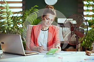 happy modern bookkeeper woman at work in red jacket