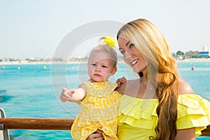 Happy mom and child girl hugging. The concept of childhood and family. Beautiful Mother and her baby outdoor