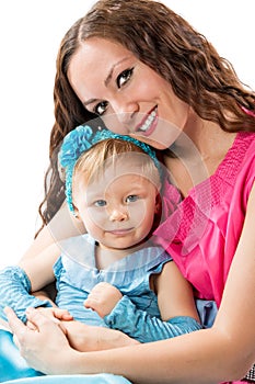 Happy mom and child girl hugging and laughing isolate on white background. The concept of cheerful childhood and family