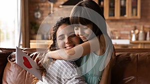 Happy mom and daughter girl celebrating mothers day, 8 march