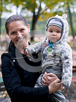 Happy mom holding baby boy